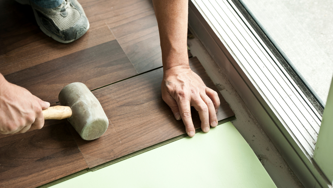 Fitting replacement wood planks with a rubber mallet