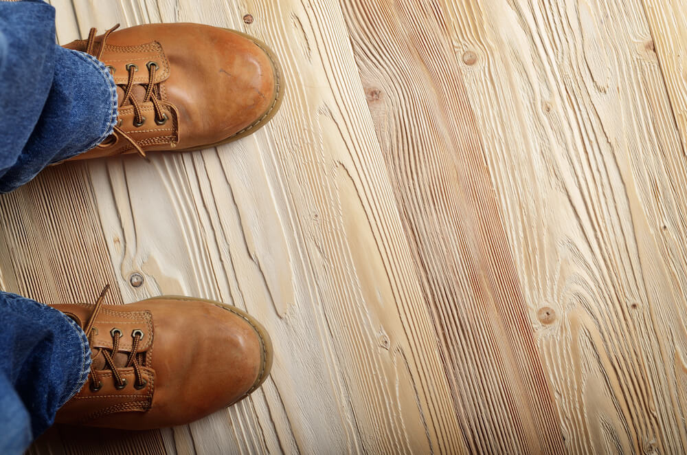 Unfinished wood flooring planks prepared for refinishing