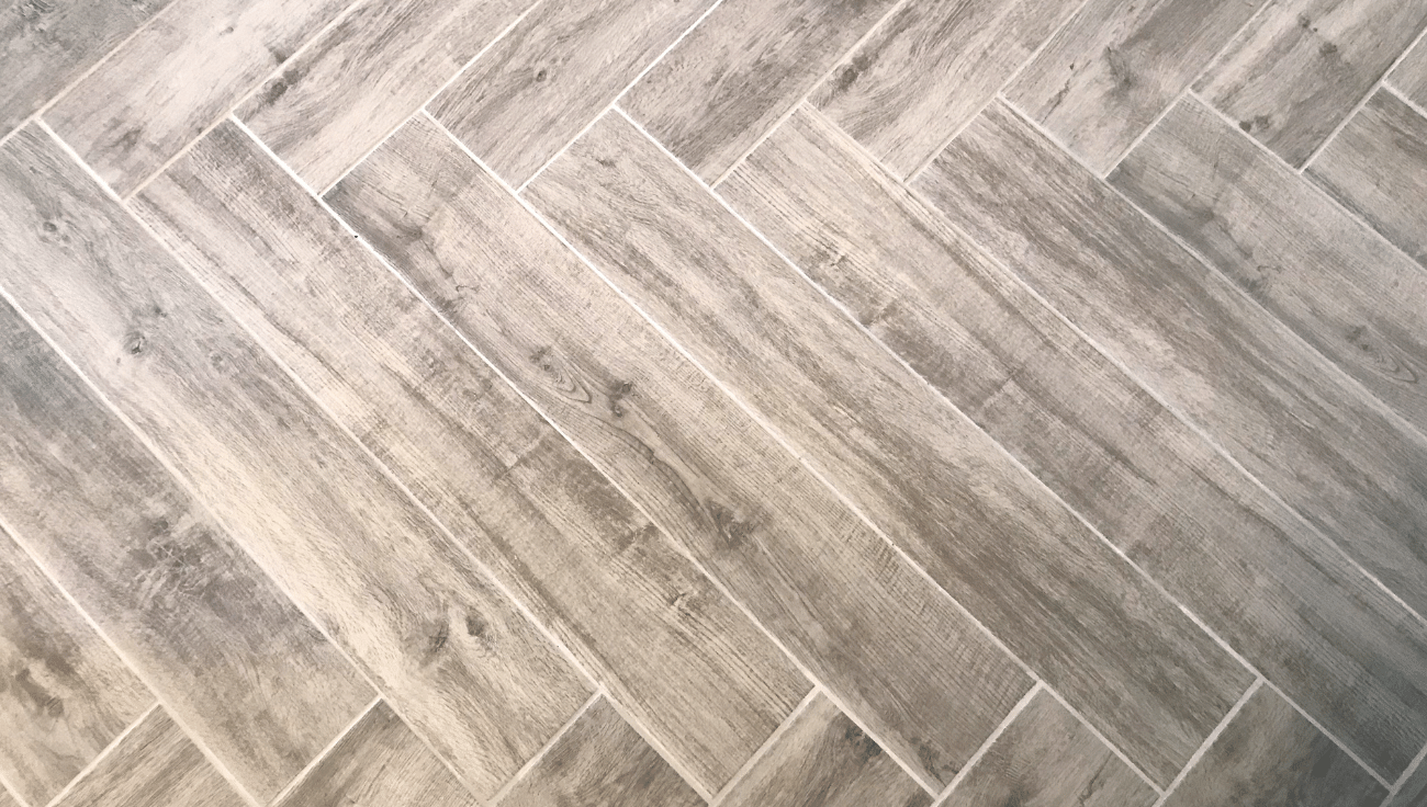 Herringbone pattern wood flooring close-up