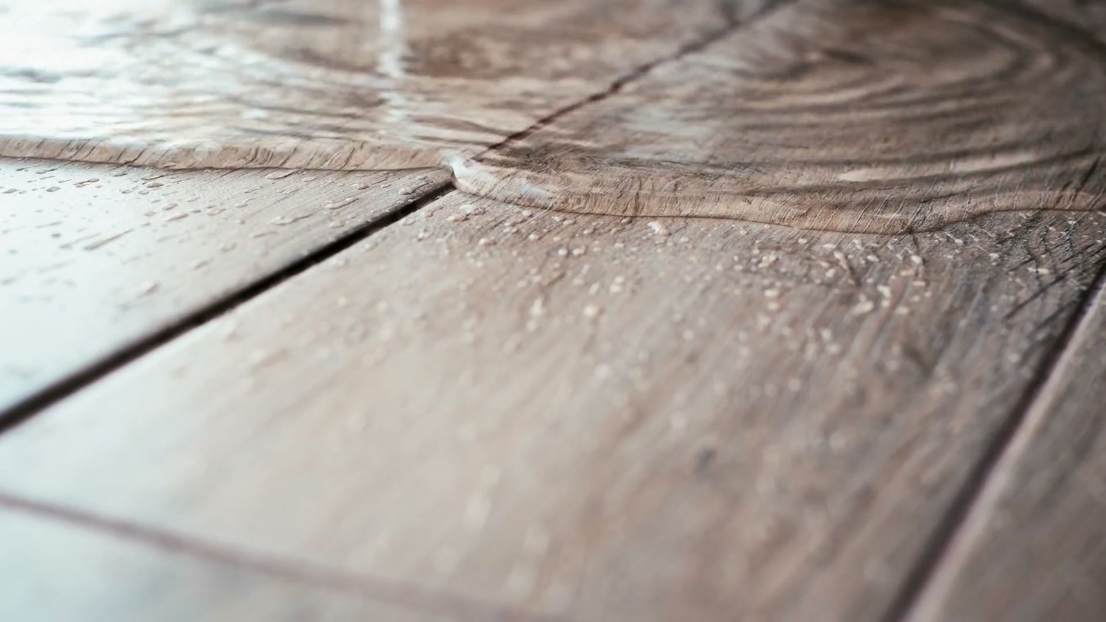 Water spreading across wood flooring